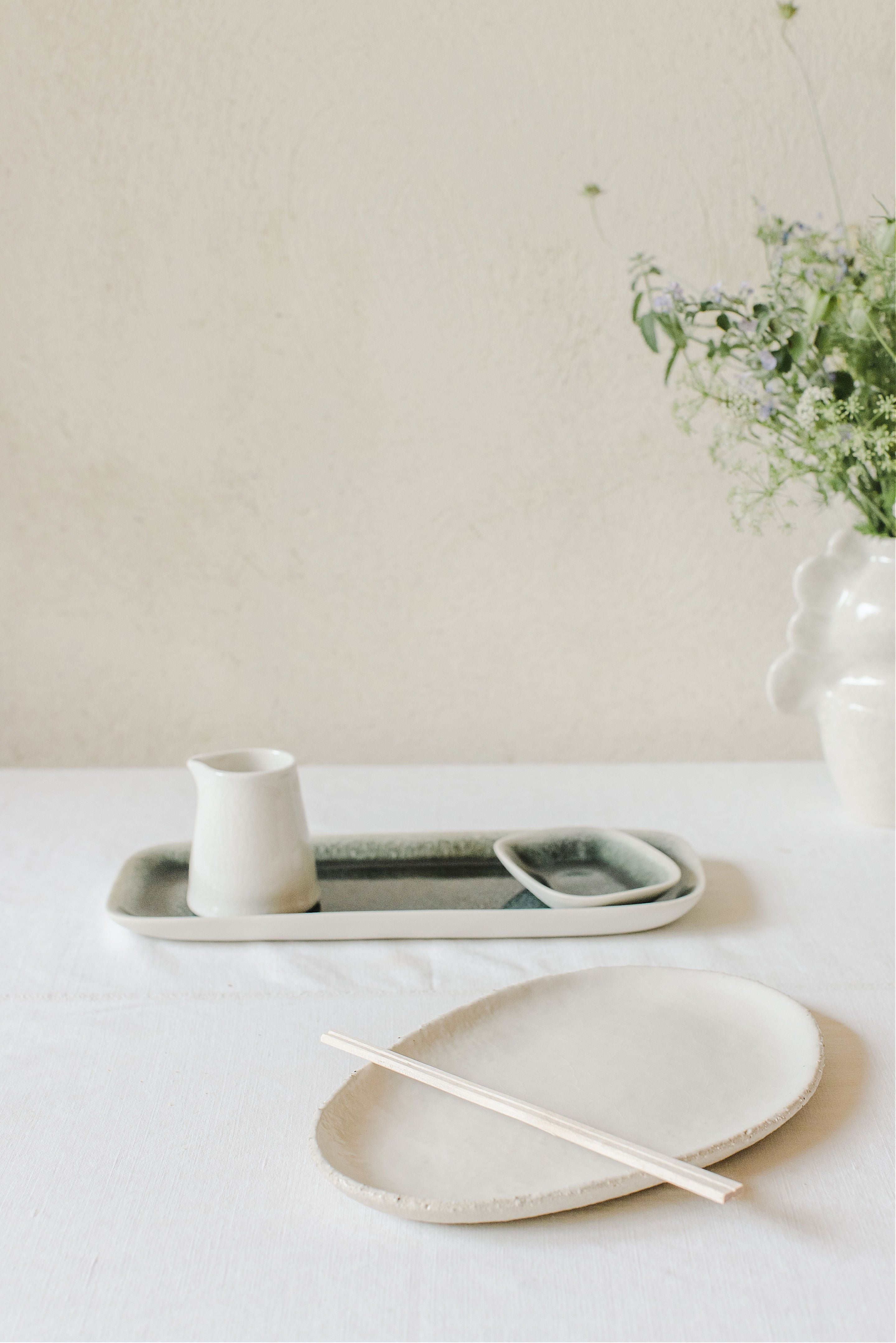 Curved Glazed Ceramic Creamer